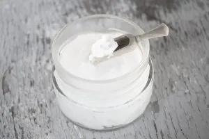 Coconut oil on wooden spoon - Laura's Idea